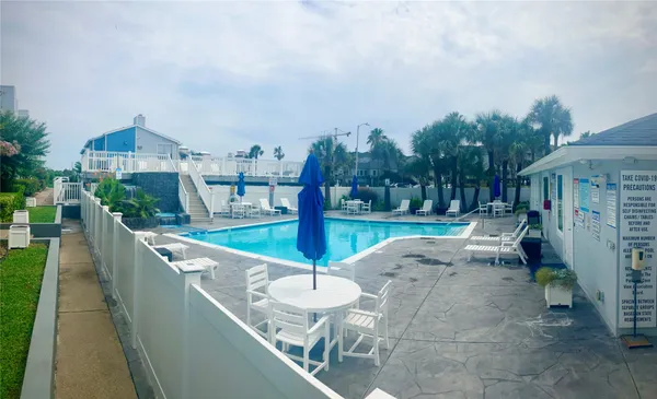 a living room with furniture a rug and a fireplace