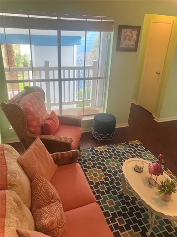 a view of livingroom with furniture and wooden floor