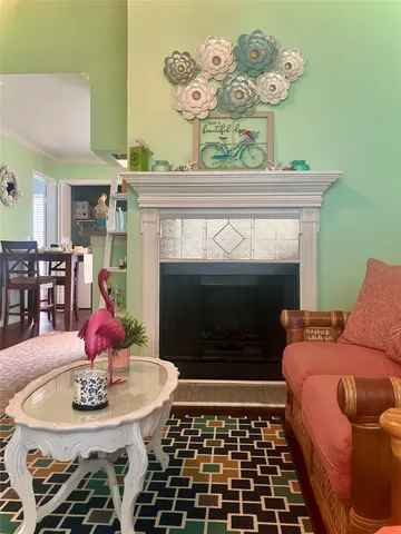 a kitchen with stainless steel appliances granite countertop a refrigerator a sink and white cabinets