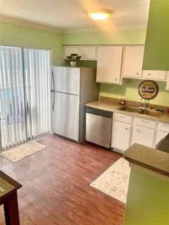 a view of room with window and wooden floor