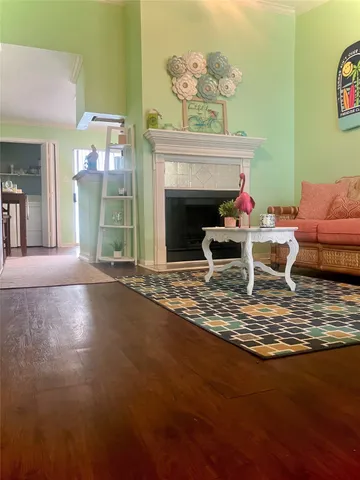 a front view of a house with entryway and plants