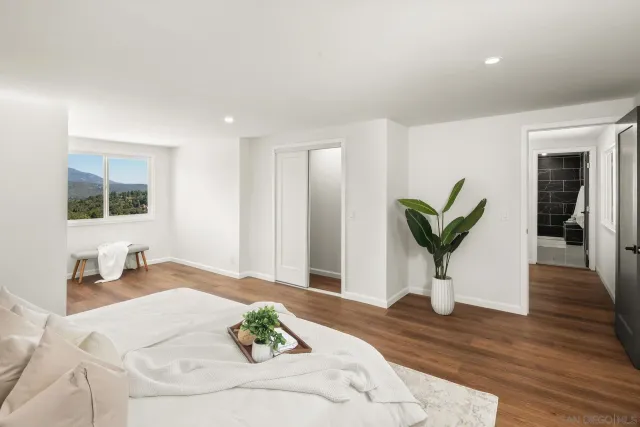 a view of a livingroom with furniture and wooden floor