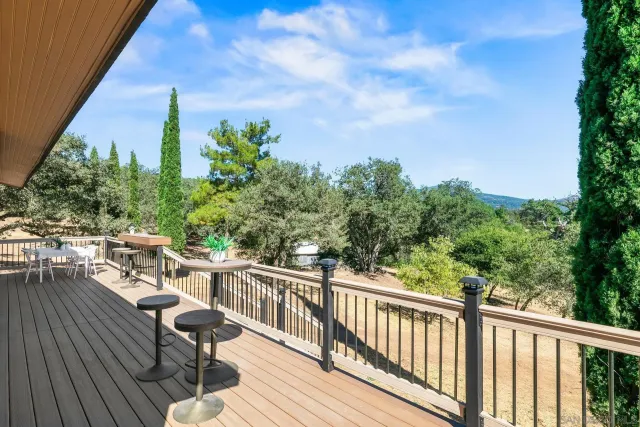 a view of a balcony with chairs
