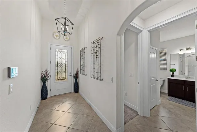 a view of a hallway with bathroom