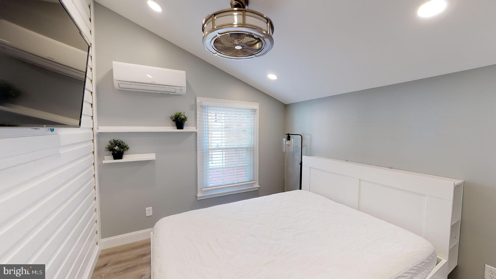 27 South Church Street, Unit 1 West Chester, PA 19382 - Photo 11 of 17 a bedroom with a bed and a window