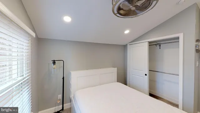 a bathroom with a toilet a sink and a window