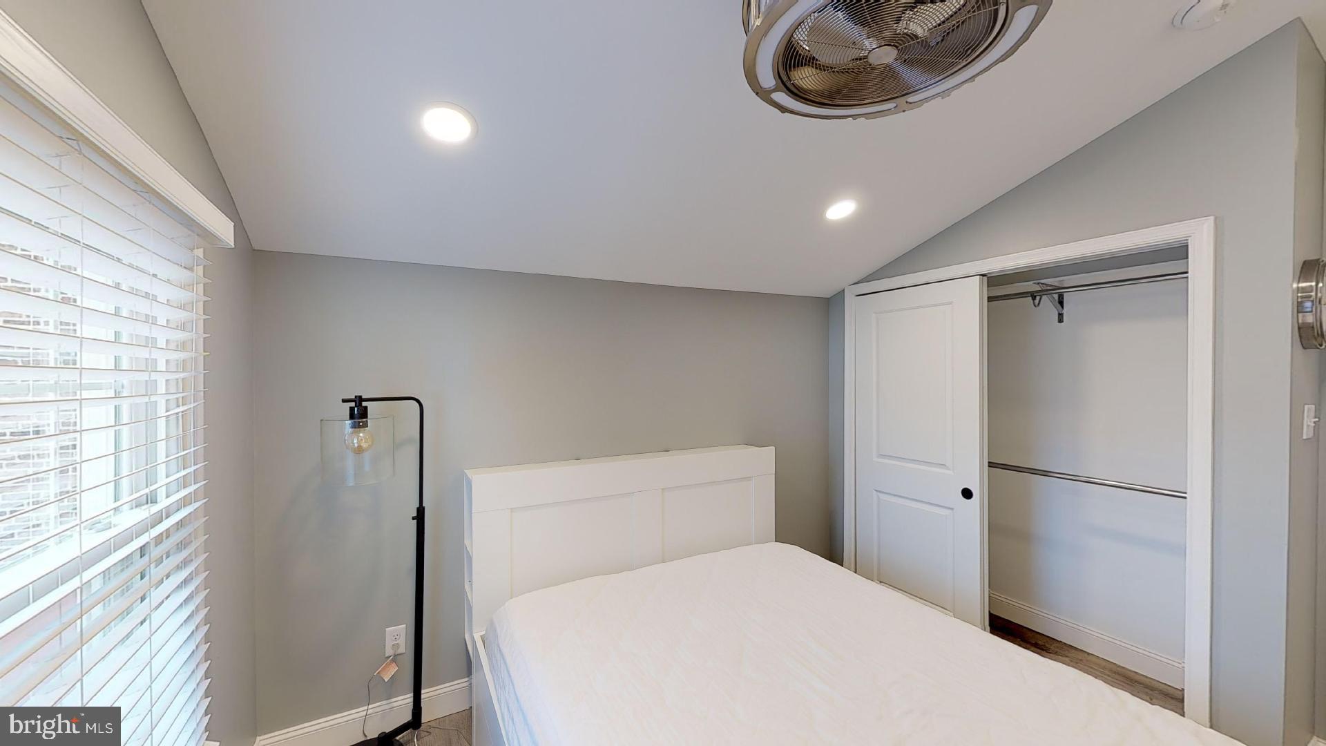 27 South Church Street, Unit 1 West Chester, PA 19382 - Photo 12 of 17 a bathroom with a toilet a sink and a window