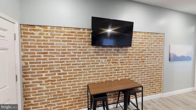 a dining room with a table and chairs