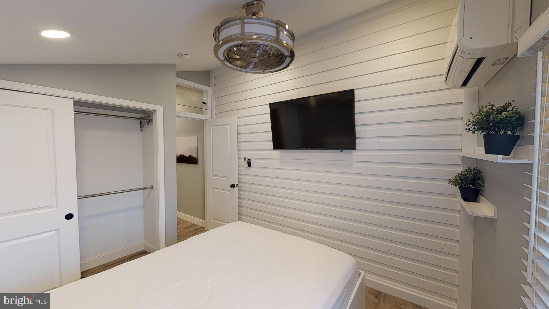 27 South Church Street, Unit 1 West Chester, PA 19382 - Photo 7 of 17 a bathroom with a toilet a sink and mirror