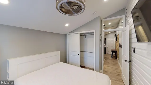 a bedroom with a bed and a view of bathroom