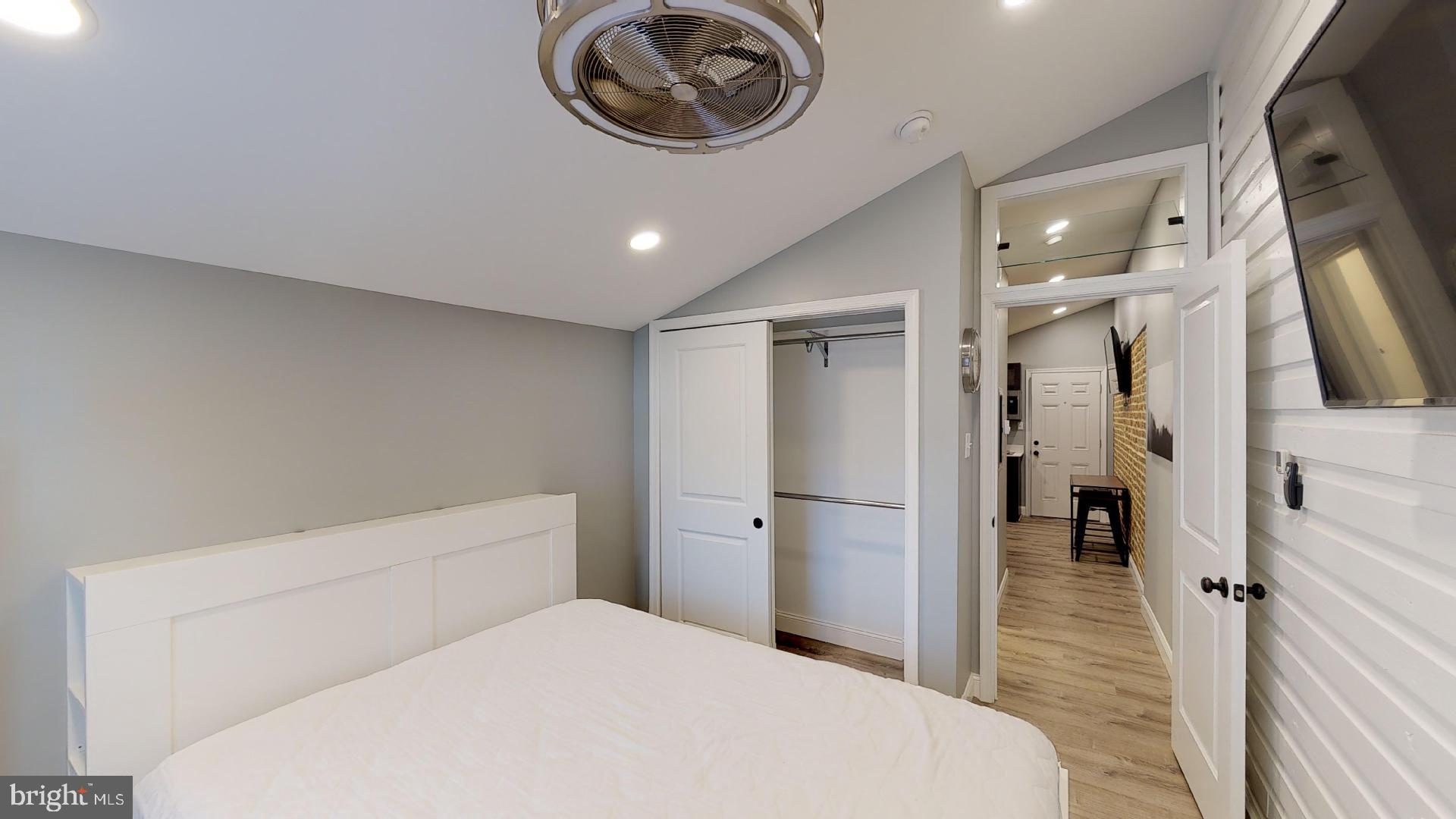 27 South Church Street, Unit 1 West Chester, PA 19382 - Photo 8 of 17 a bedroom with a bed and a view of bathroom