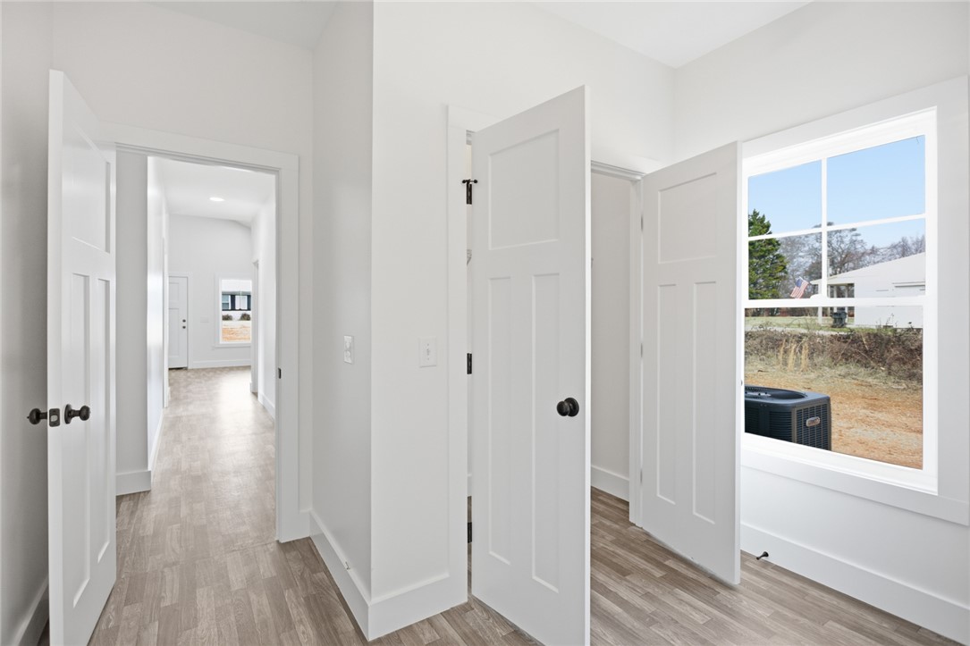 115 Riley Street Westminster, SC 29693 - Photo 19 of 46 This bright hallway connects spaces with clean lines and abundant natural light.
