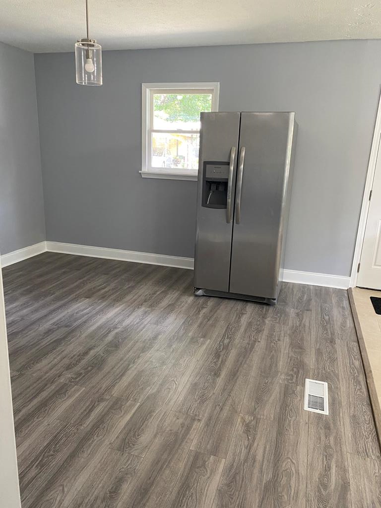 1061 Dunbar Avenue Columbus, GA 31906 - Photo 16 of 23 a view of kitchen with wooden floor electronic appliances and window