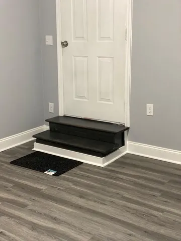 a view of an empty room with a window