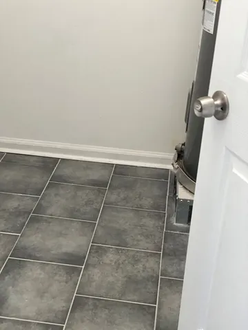 a view of wooden floor and windows in a room