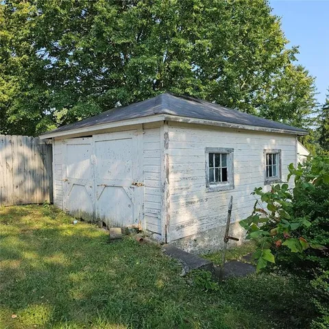 a backyard of a house with lots of green space