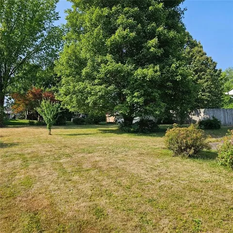 a view of outdoor space with deck and yard