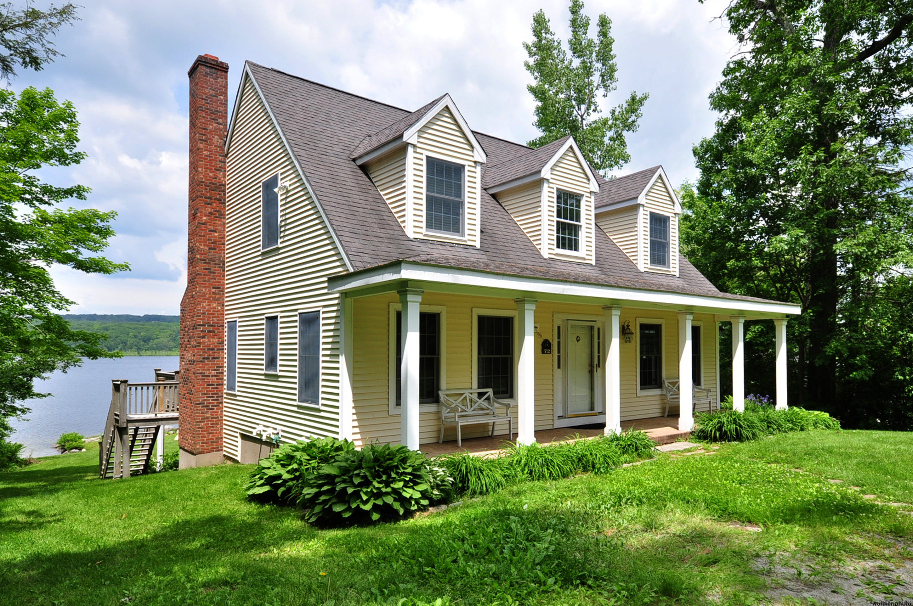 72 Sandy Beach Road Goshen, CT 06756 - Photo 1 of 33 a front view of a house with a yard