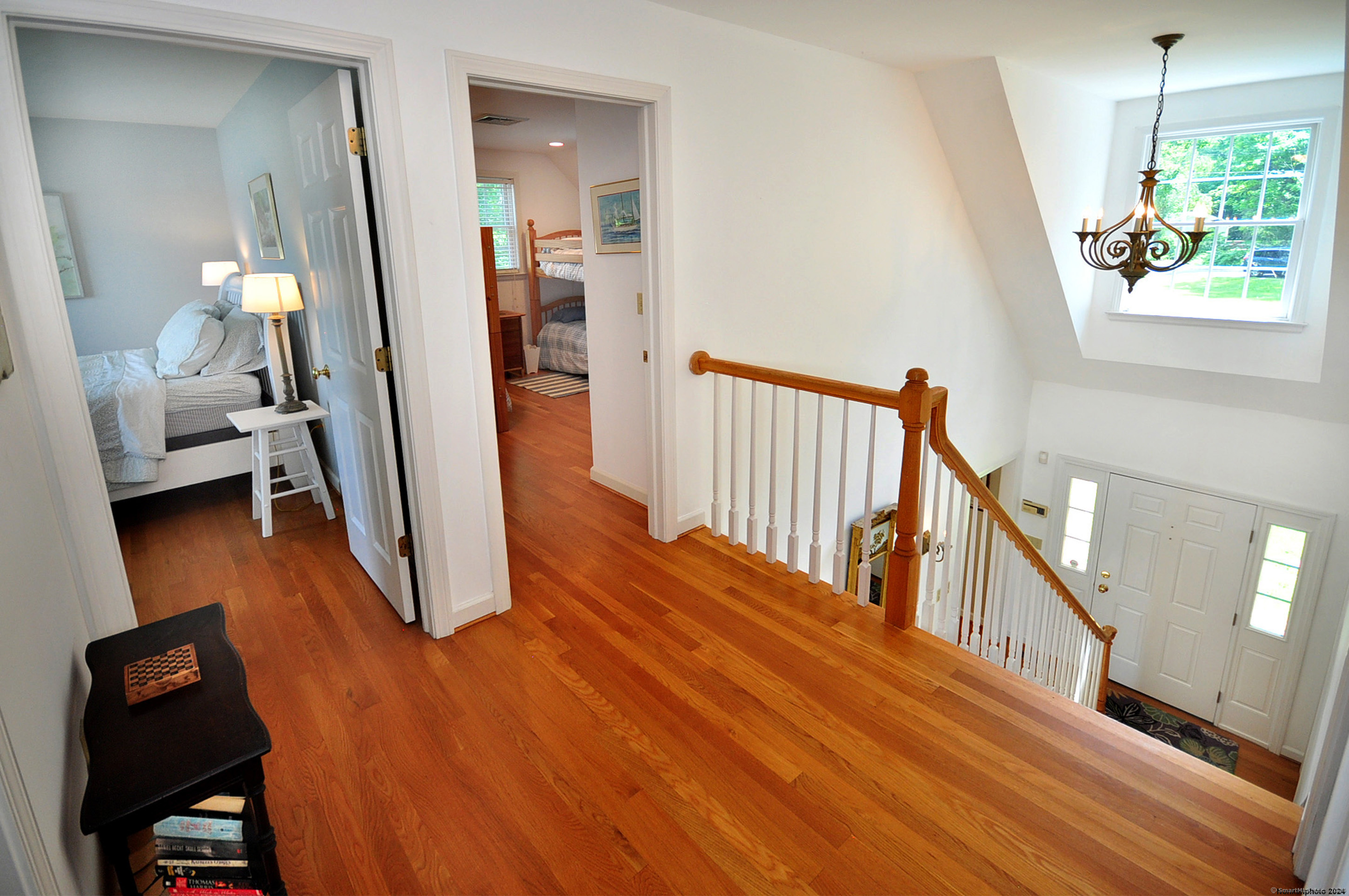 72 Sandy Beach Road Goshen, CT 06756 - Photo 17 of 33 a view of a hallway with wooden floor and staircase