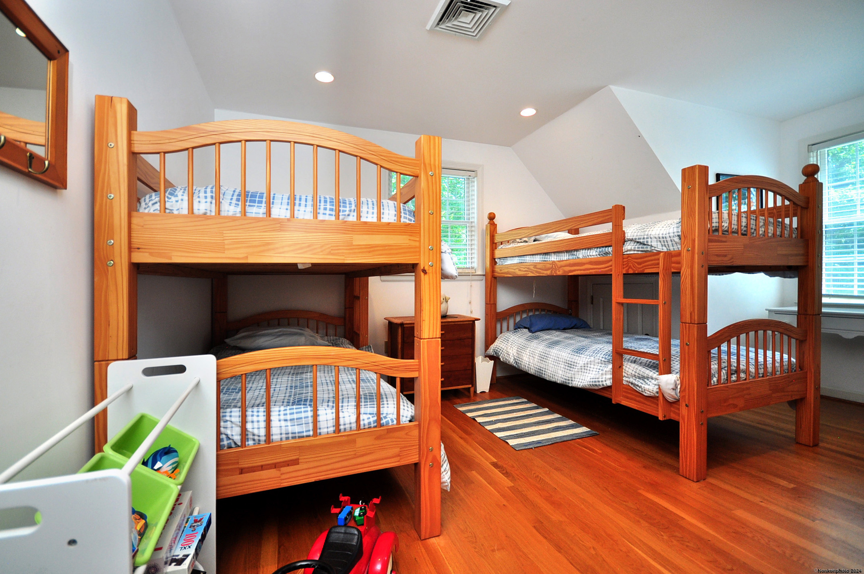 72 Sandy Beach Road Goshen, CT 06756 - Photo 19 of 33 a bedroom with a bed and a wooden floor