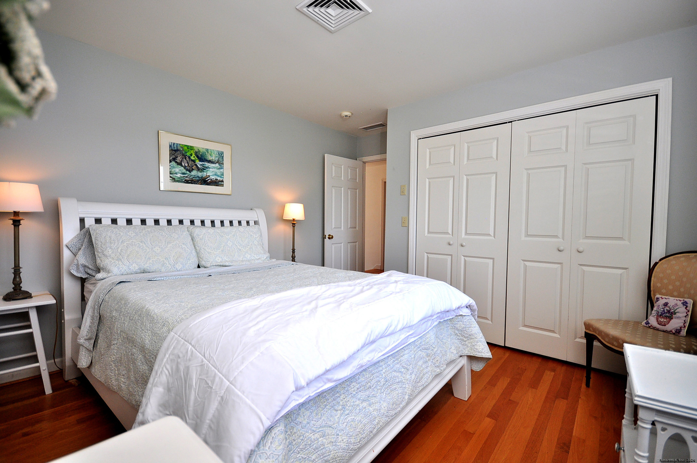 72 Sandy Beach Road Goshen, CT 06756 - Photo 21 of 33 a bedroom with bed and wooden floor