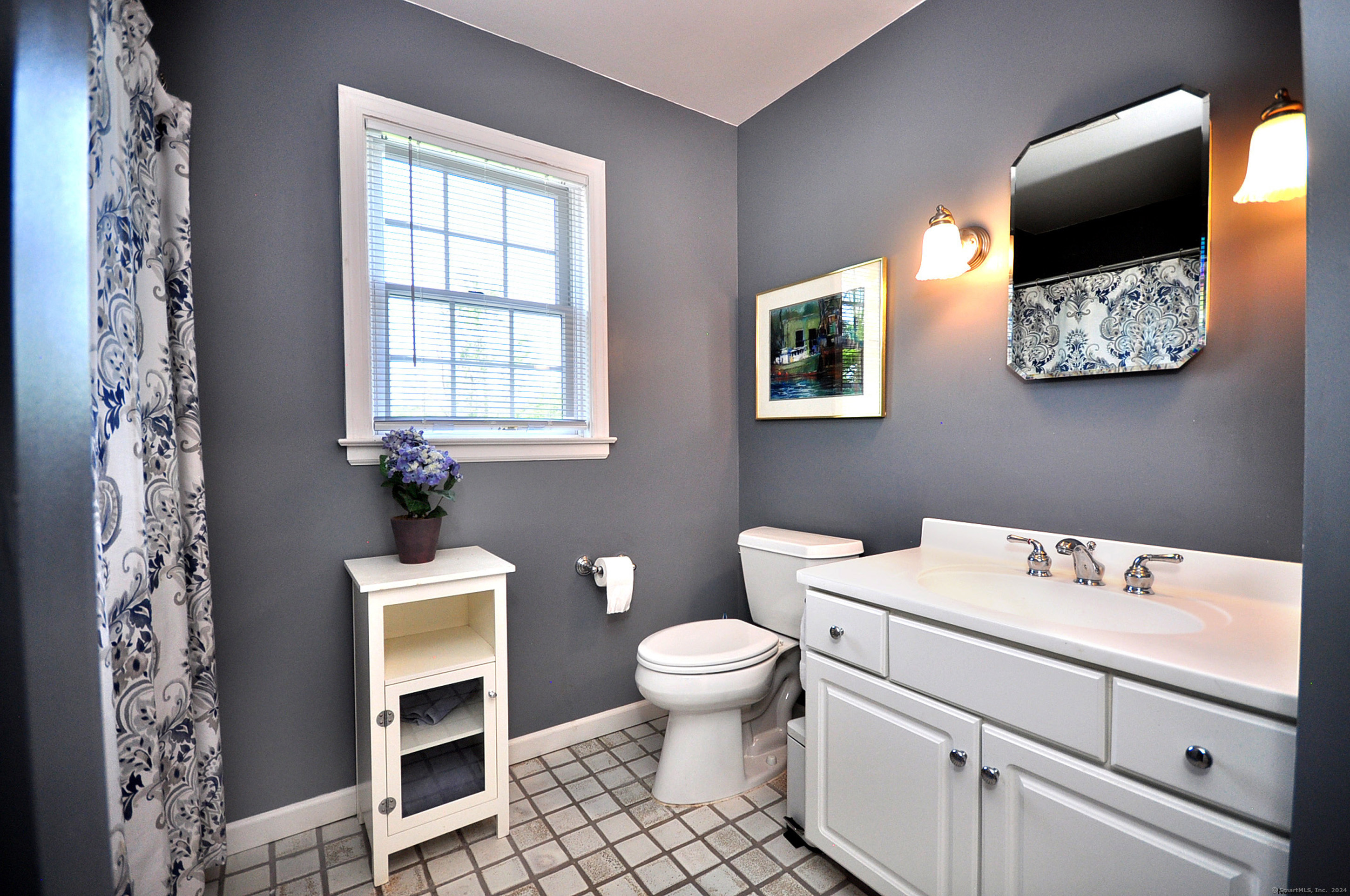 72 Sandy Beach Road Goshen, CT 06756 - Photo 22 of 33 a bathroom with a toilet sink and mirror