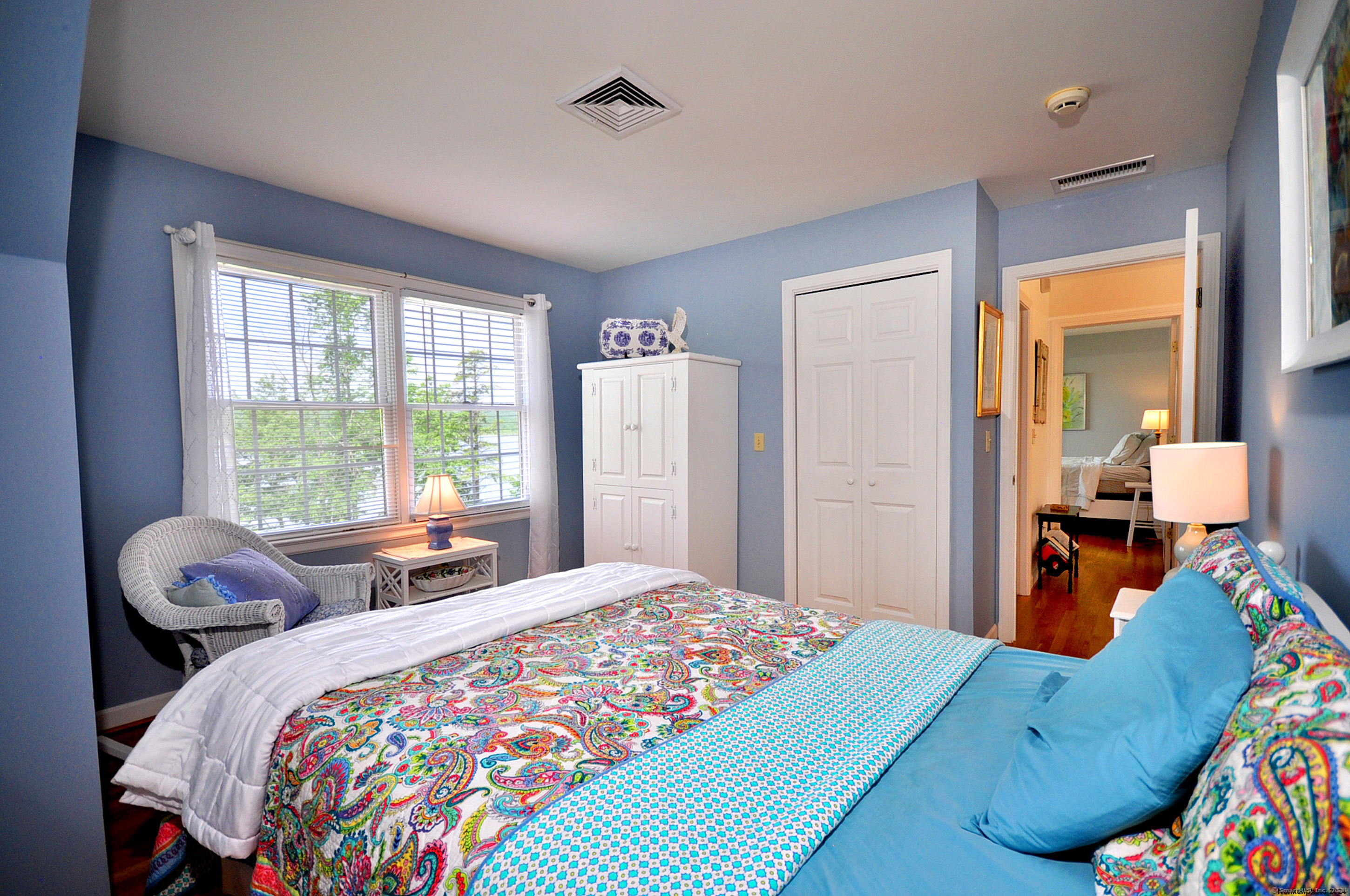 72 Sandy Beach Road Goshen, CT 06756 - Photo 26 of 33 a bed room with a bed and a large window