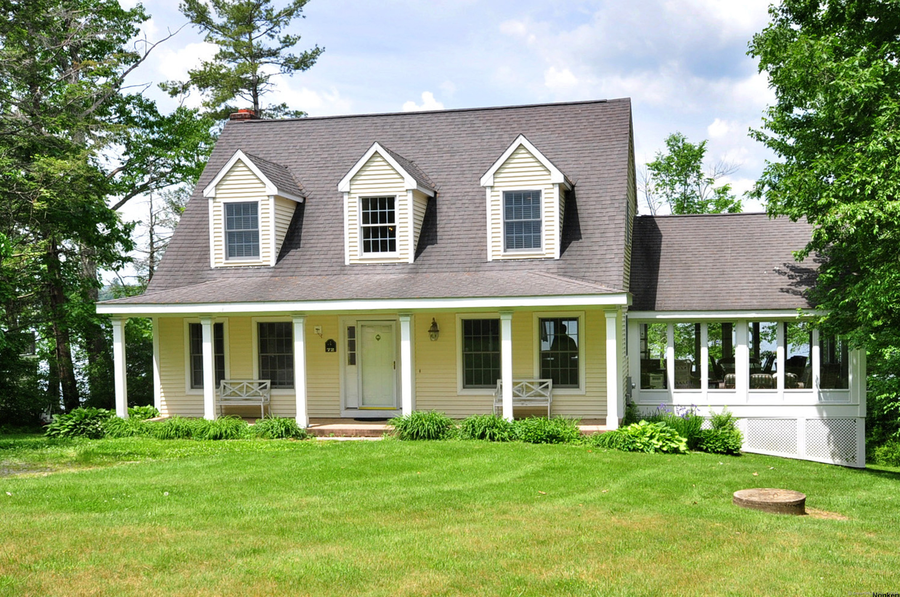 72 Sandy Beach Road Goshen, CT 06756 - Photo 27 of 33 front view of a house with a yard