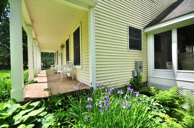 a front view of a house with garden