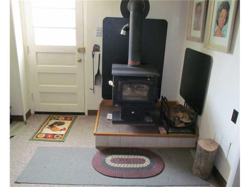 295 Olympic Road Baldwin, PA 15236 - Photo 14 of 20 Family Room. Wood-burning stove in L-Shaped part of gameroom.