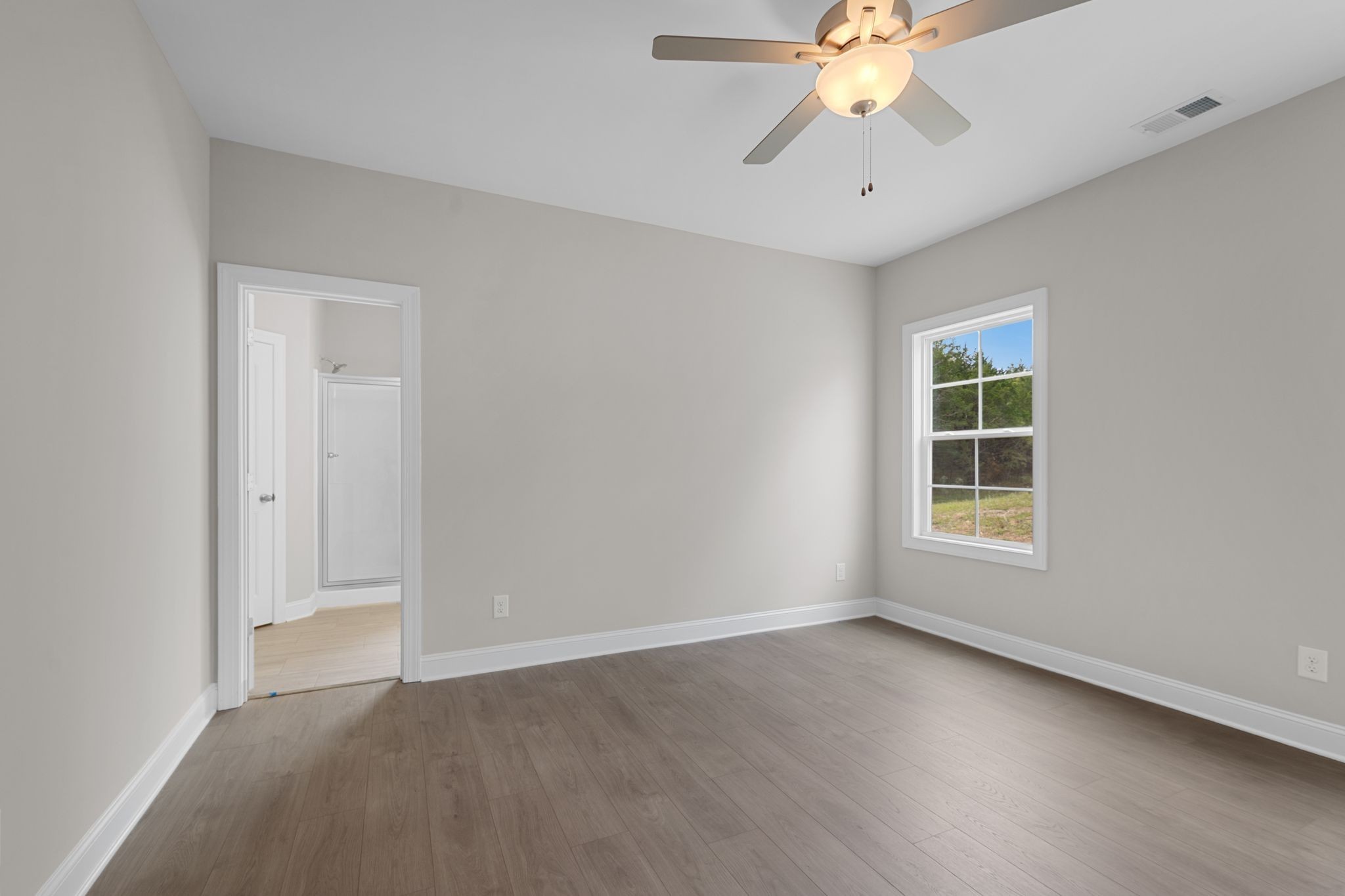 443 Generosity Way Smyrna, TN 37167 - Photo 14 of 37 an empty room with chandelier fan and windows