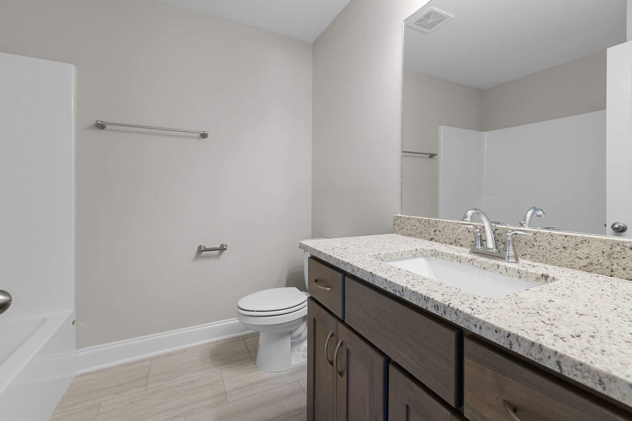 443 Generosity Way Smyrna, TN 37167 - Photo 29 of 37 a bathroom with a granite countertop sink a toilet and a mirror