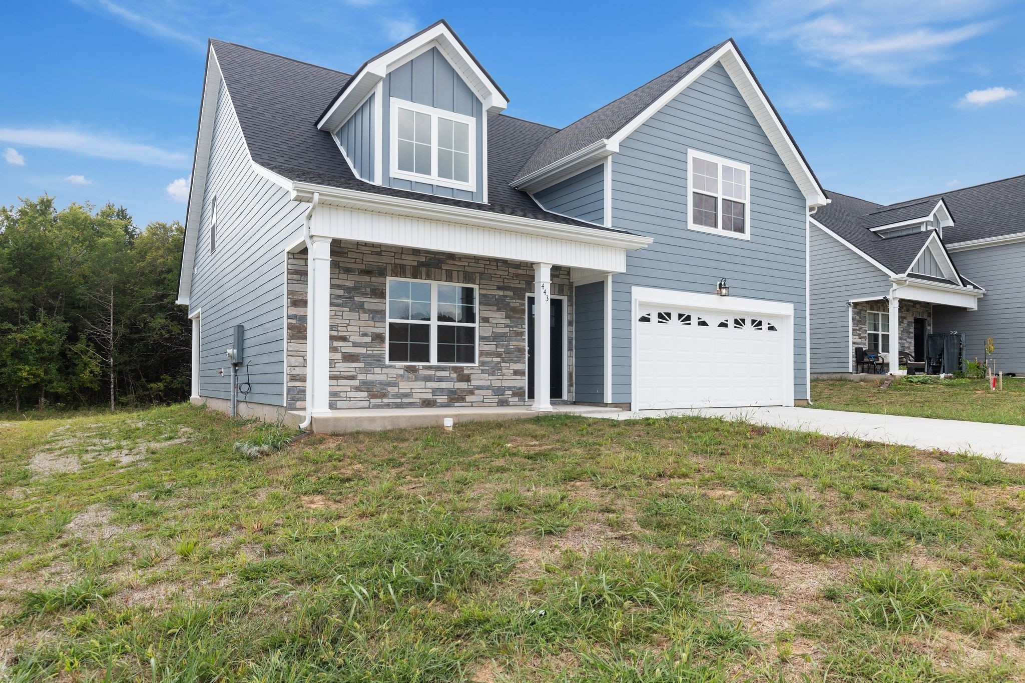 443 Generosity Way Smyrna, TN 37167 - Photo 3 of 37 a front view of a house with a garden