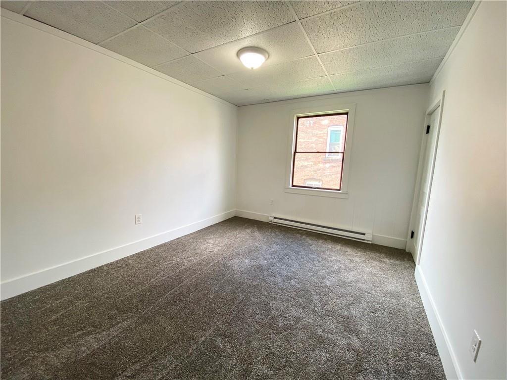 7 Main Street Lyndora, PA 16045 - Photo 12 of 25 an empty room with a empty space and windows