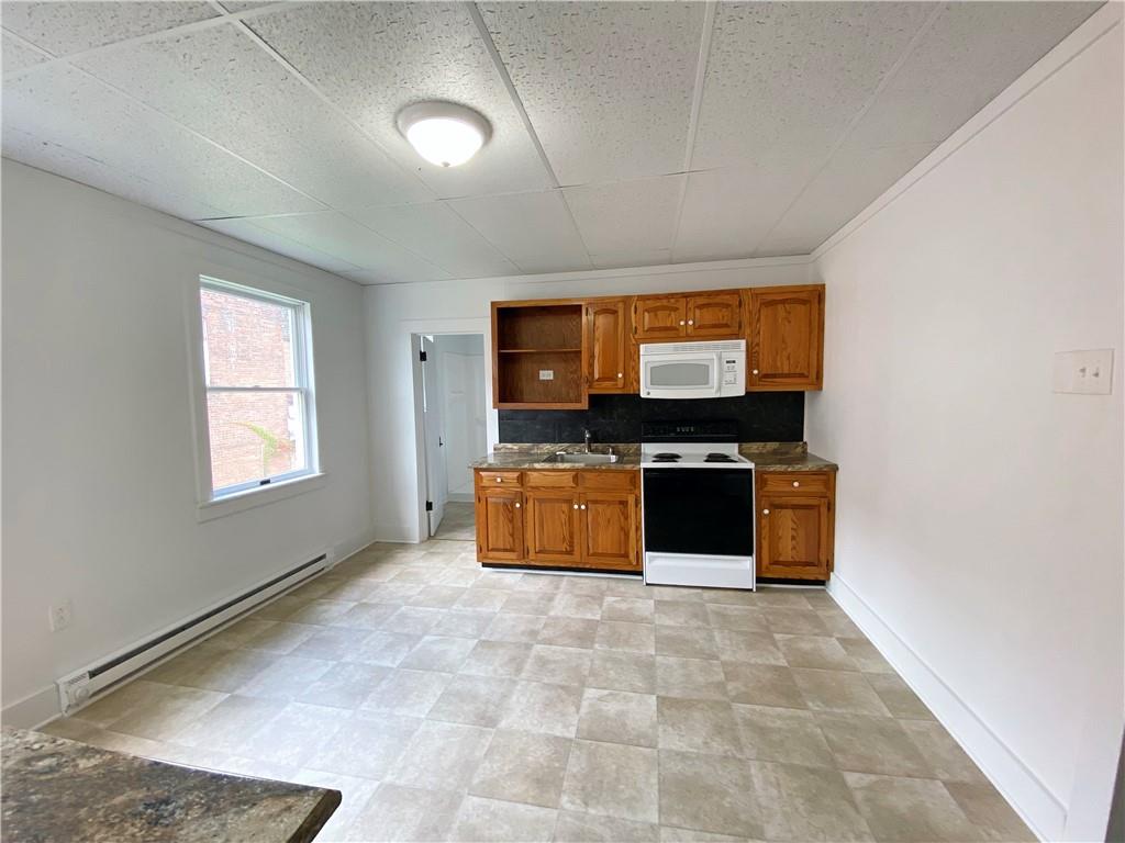 7 Main Street Lyndora, PA 16045 - Photo 15 of 25 a living room with furniture and a flat screen tv