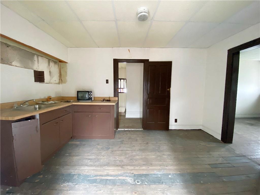 7 Main Street Lyndora, PA 16045 - Photo 20 of 25 a kitchen with a sink and a stove top oven