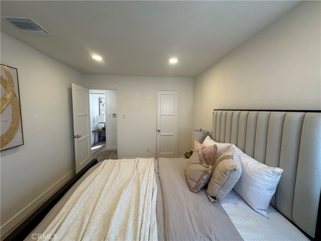 6401 Day Street Tujunga, CA 91042 - Photo 23 of 33 a bedroom with a bed and window