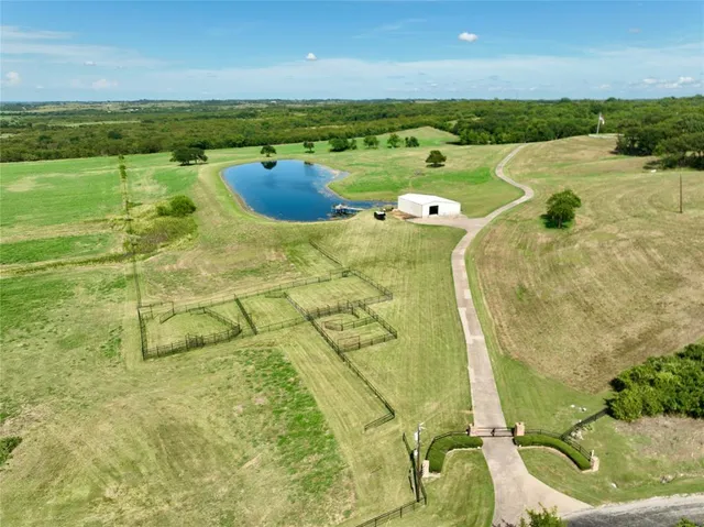 a view of a swimming pool and an outdoor seating