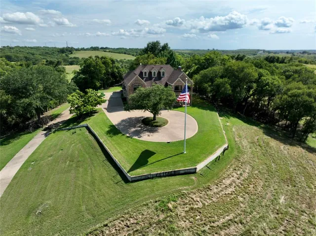 a view of a swimming pool with a yard