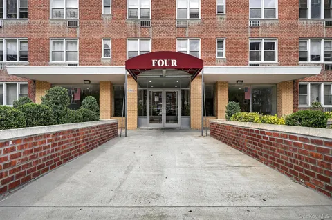 a front view of a building with a porch