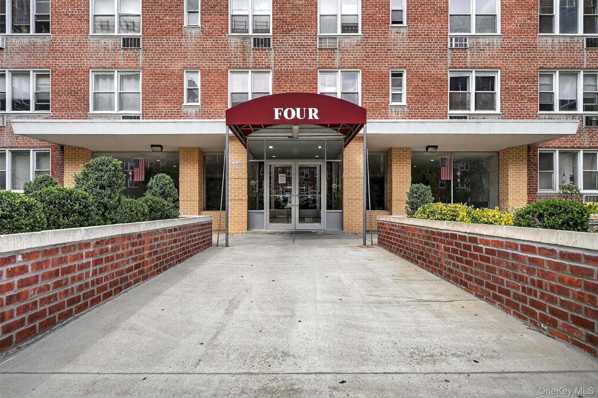 4 Sadore Lane, Unit 4U Yonkers, NY 10710 - Photo 1 of 22 a front view of a building with a porch