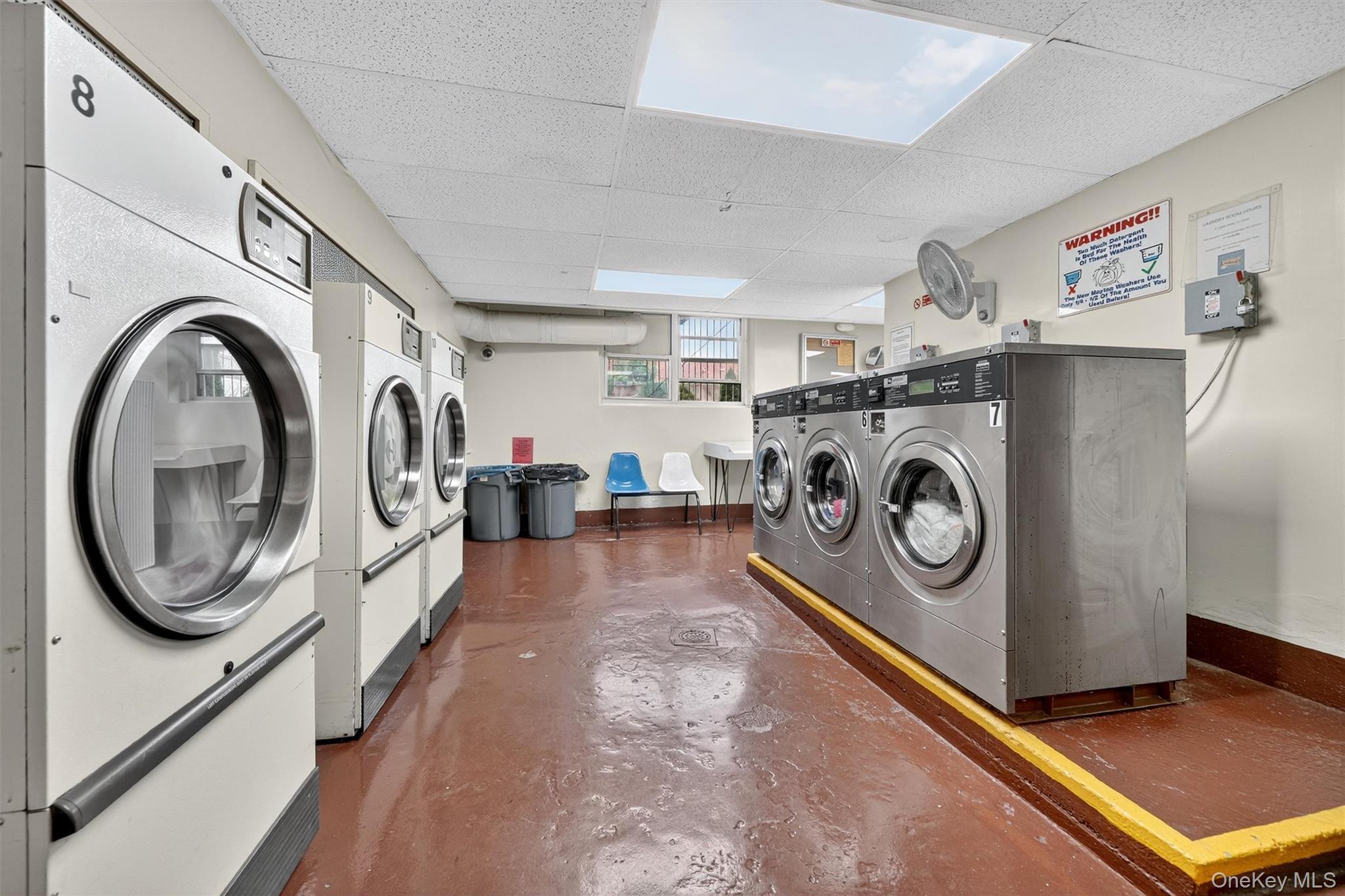 4 Sadore Lane, Unit 4U Yonkers, NY 10710 - Photo 18 of 22 a utility room with dryer and washer