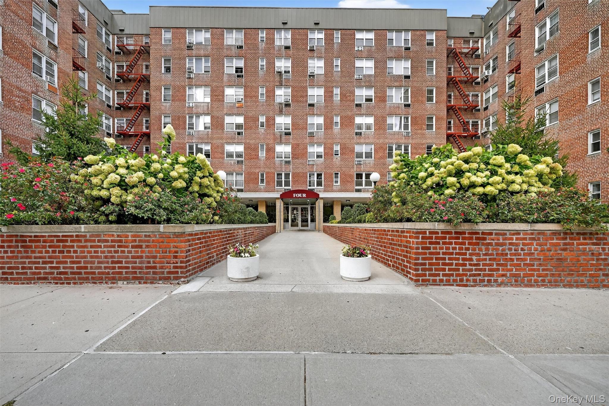 4 Sadore Lane, Unit 4U Yonkers, NY 10710 - Photo 2 of 22 a view of building with outdoor space