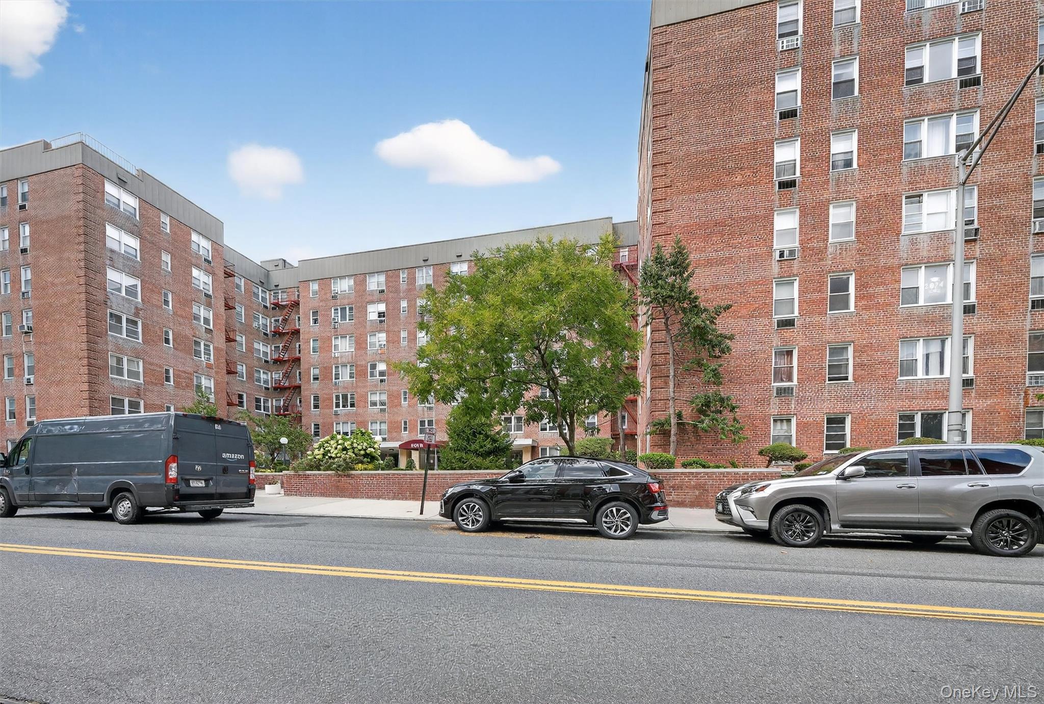 4 Sadore Lane, Unit 4U Yonkers, NY 10710 - Photo 21 of 22 a view of a cars parked in front of a building