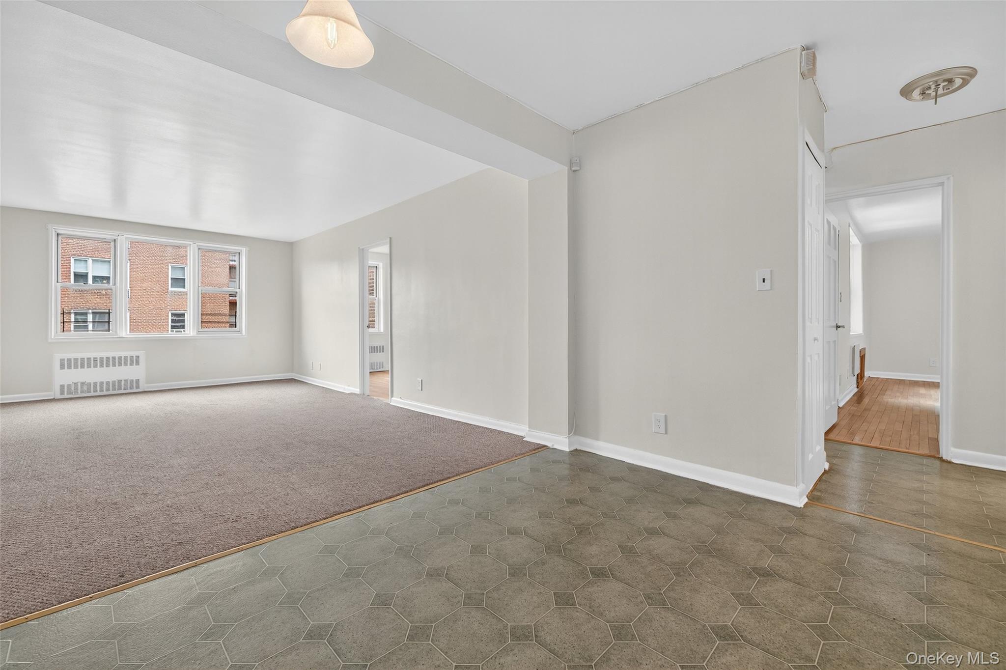 4 Sadore Lane, Unit 4U Yonkers, NY 10710 - Photo 5 of 22 a view of an empty room with a window