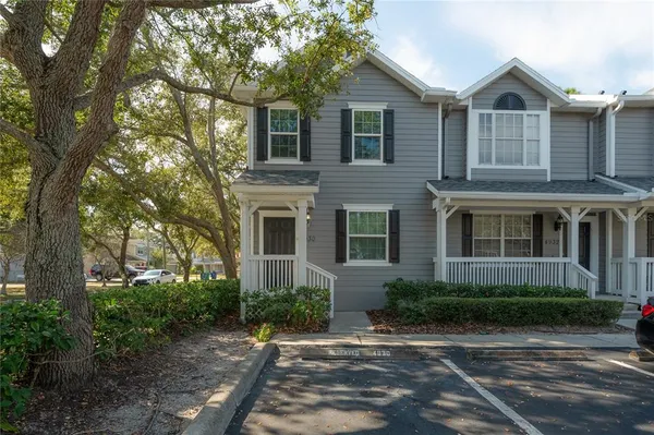 a front view of a house with yard