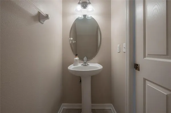 a bathroom with a sink and mirror
