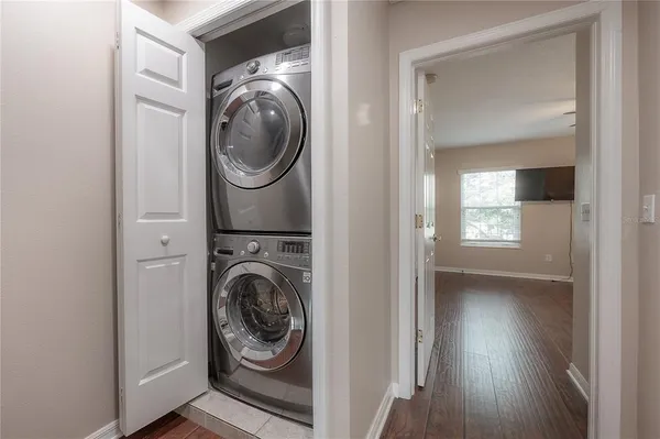 a view of a hallway with washer and dryer