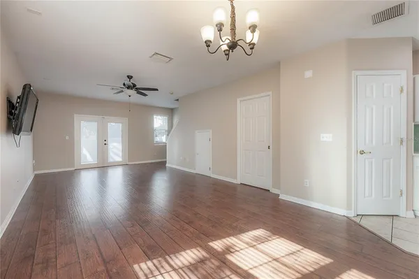 a view of livingroom and kitchen with wooden floor