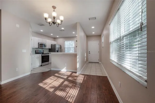 a view of kitchen with cabinets and wooden floor